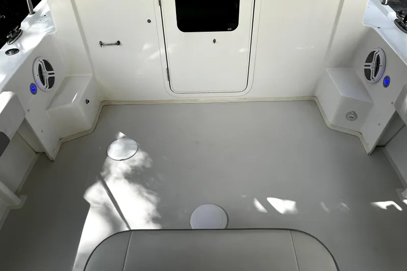 Slide: The Image of 2023 Parker 2120 Sport Cabin interior with speakers and seating. - 24