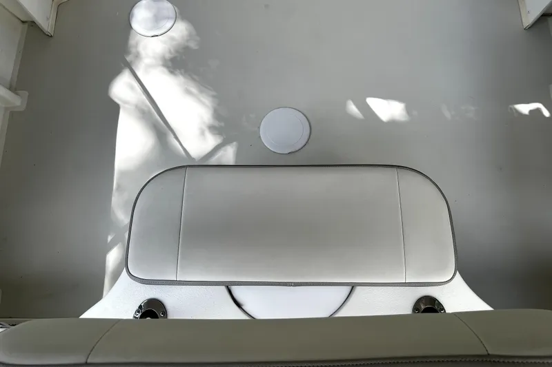 Slide: The Image of 2023 Parker 2120 Sport Cabin interior with cushioned seating and sleek design. - 25