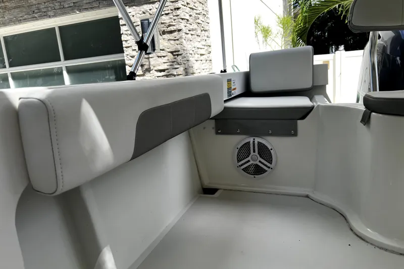 Slide: The Image of 2023 Parker 2120 Sport Cabin interior with cushioned seating and speaker. - 31