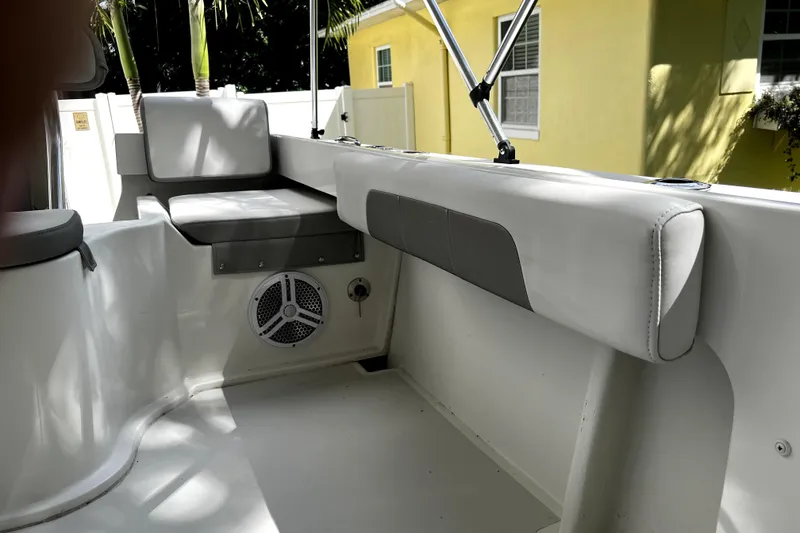 Slide: The Image of 2023 Parker 2120 Sport Cabin interior with cushioned seating and speaker. - 35