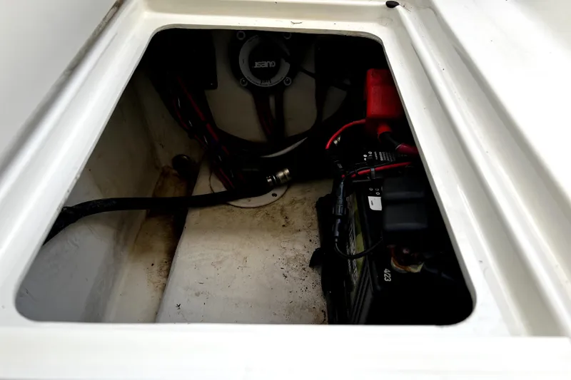 Slide: The Image of Battery compartment of 2023 Parker 2120 Sport Cabin boat, showing wiring and connections. - 38