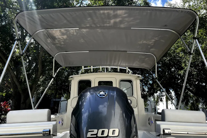Slide: The Image of 2023 Parker 2120 Sport Cabin boat with canopy and powerful 200 engine. - 4