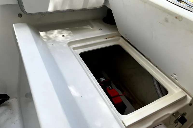 Slide: The Image of Open storage compartment in 2023 Parker 2120 Sport Cabin boat. - 41