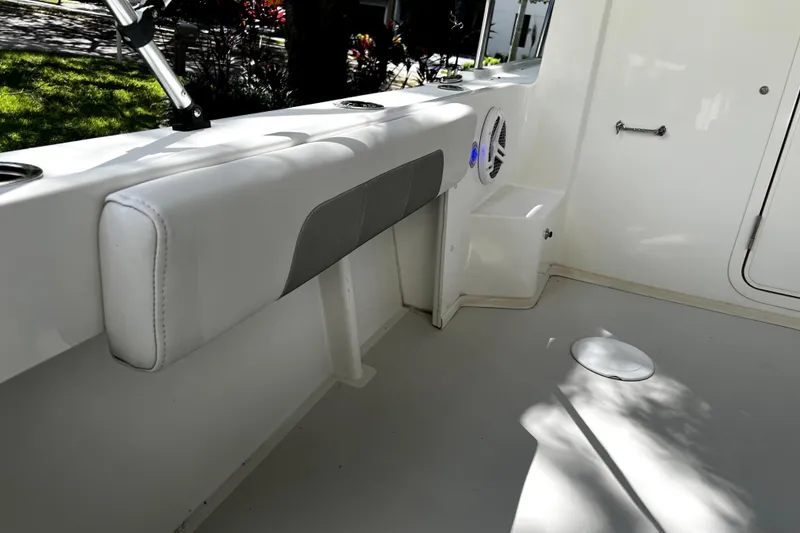 Slide: The Image of 2023 Parker 2120 Sport Cabin interior with cushioned seating and speaker. - 44