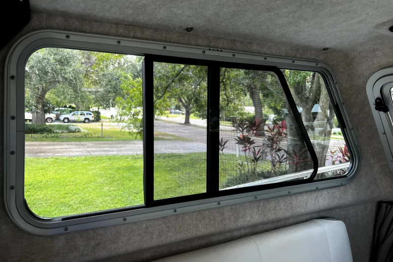 Slide: The Image of Interior view from 2023 Parker 2120 Sport Cabin, showcasing window and outdoor scenery. - 69