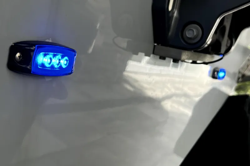 Slide: The Image of Blue LED lights on 2023 Parker 2120 Sport Cabin boat exterior. - 7