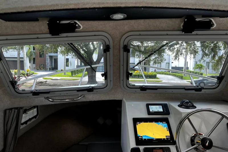 Slide: The Image of Interior view of 2023 Parker 2120 Sport Cabin with navigation system and steering wheel. - 71