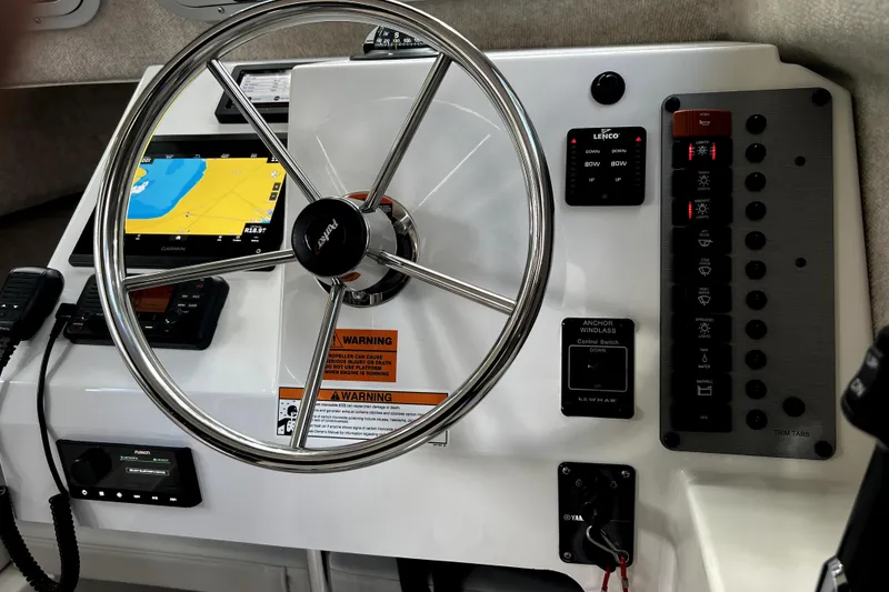 Slide: The Image of Steering wheel and control panel of 2023 Parker 2120 Sport Cabin boat. - 78