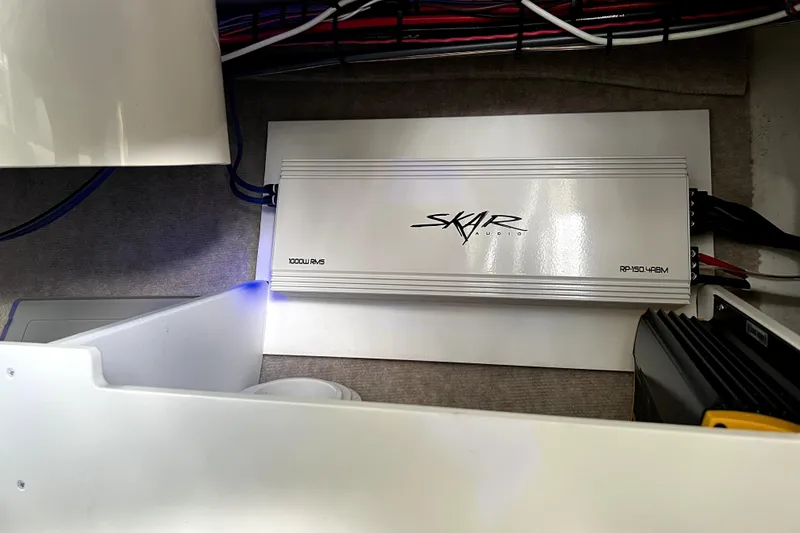 Slide: The Image of Audio amplifier installed in a 2023 Parker 2120 Sport Cabin boat. - 80
