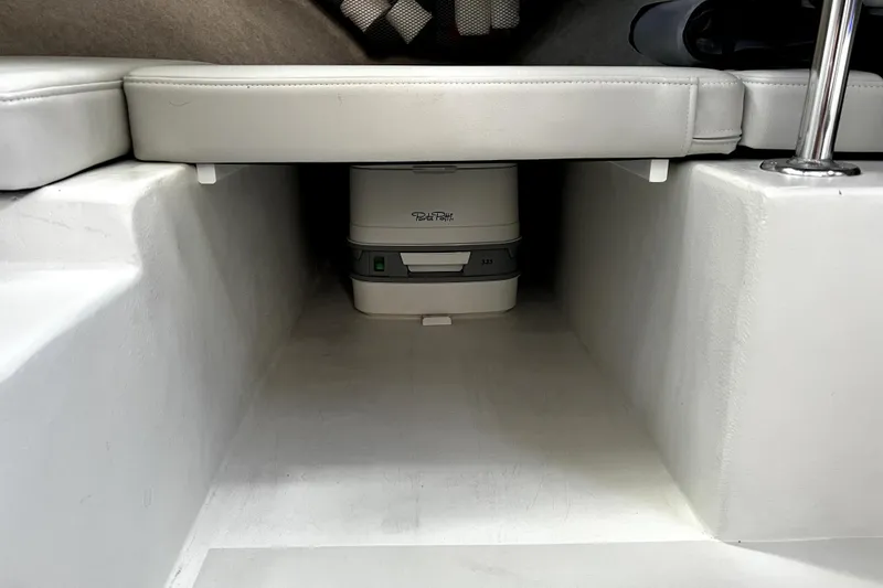 Slide: The Image of 2023 Parker 2120 Sport Cabin interior with Porta Potti under seat storage. - 81