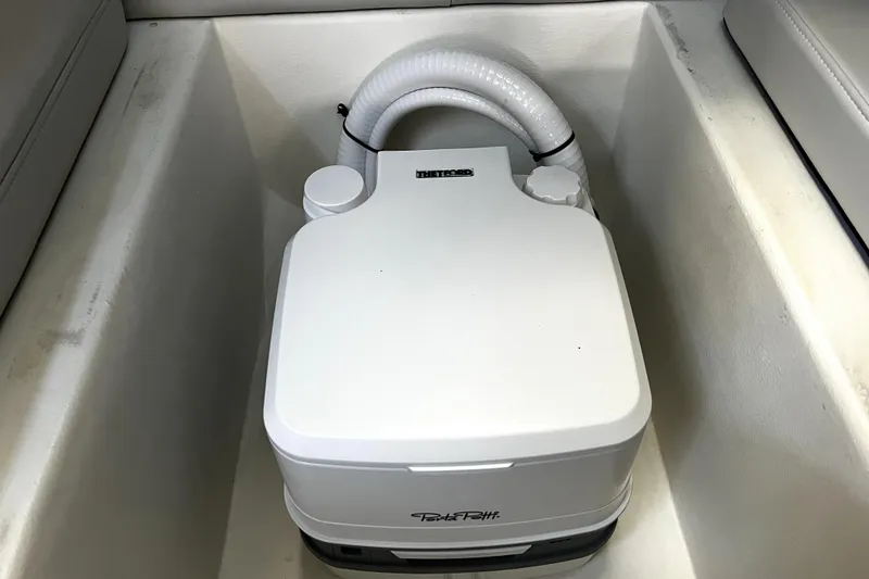 Slide: The Image of Portable toilet in 2023 Parker 2120 Sport Cabin boat interior. - 82