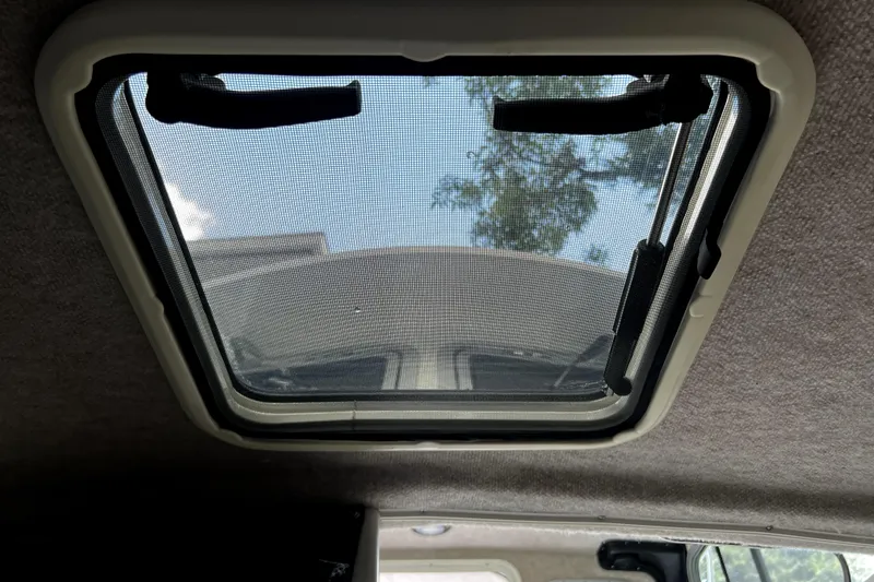 Slide: The Image of Skylight view from inside 2023 Parker 2120 Sport Cabin boat. - 88