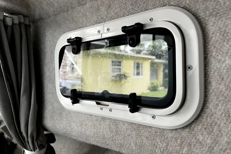 Slide: The Image of Porthole view from 2023 Parker 2120 Sport Cabin, showcasing exterior scenery. - 90