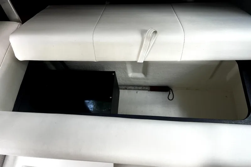 Slide: The Image of Open storage compartment in 2023 Parker 2120 Sport Cabin boat interior. - 94