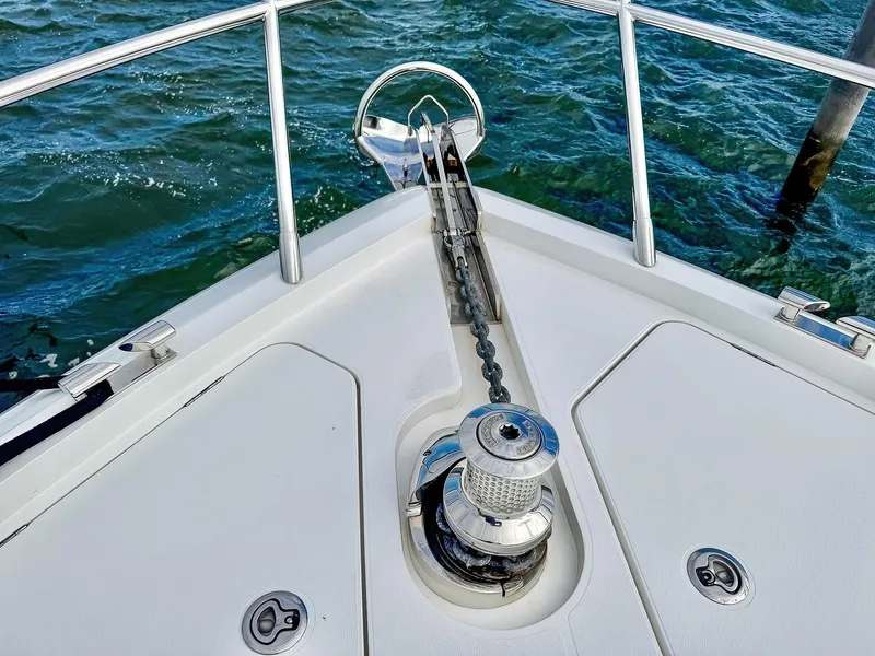 Slide: The Image of Bow of 2018 Princess S60 yacht with anchor chain and winch over water. - 18