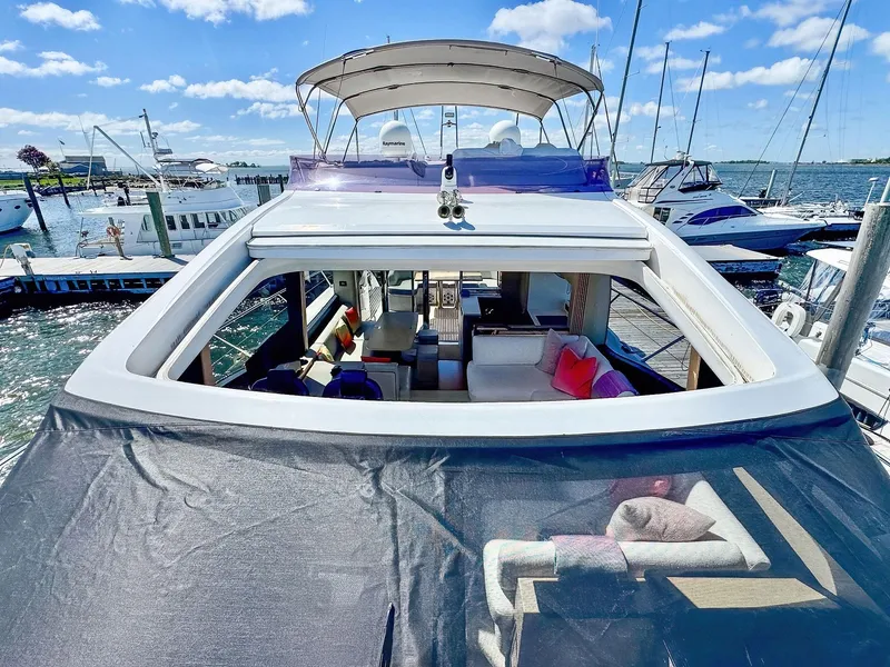 Slide: The Image of Luxurious 2018 Princess S60 yacht docked, featuring spacious interior and elegant design. - 20