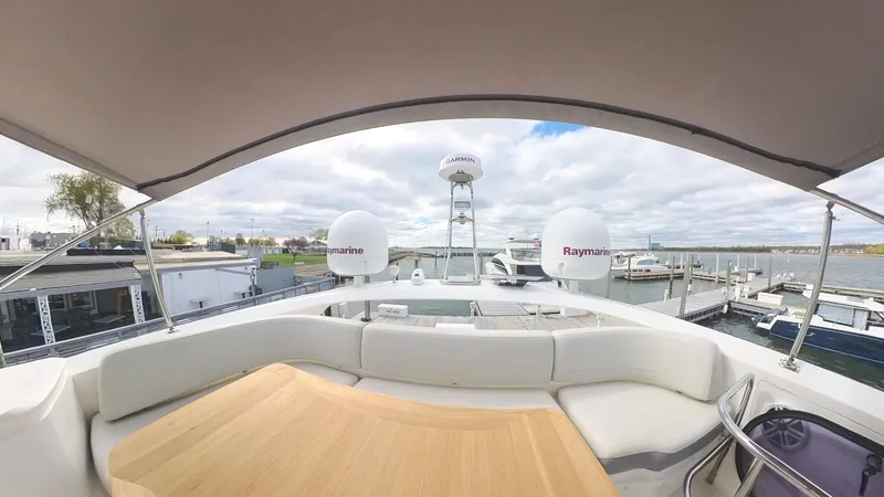 Slide: The Image of 2018 Princess S60 yacht deck with seating and Raymarine equipment, docked at marina. - 28