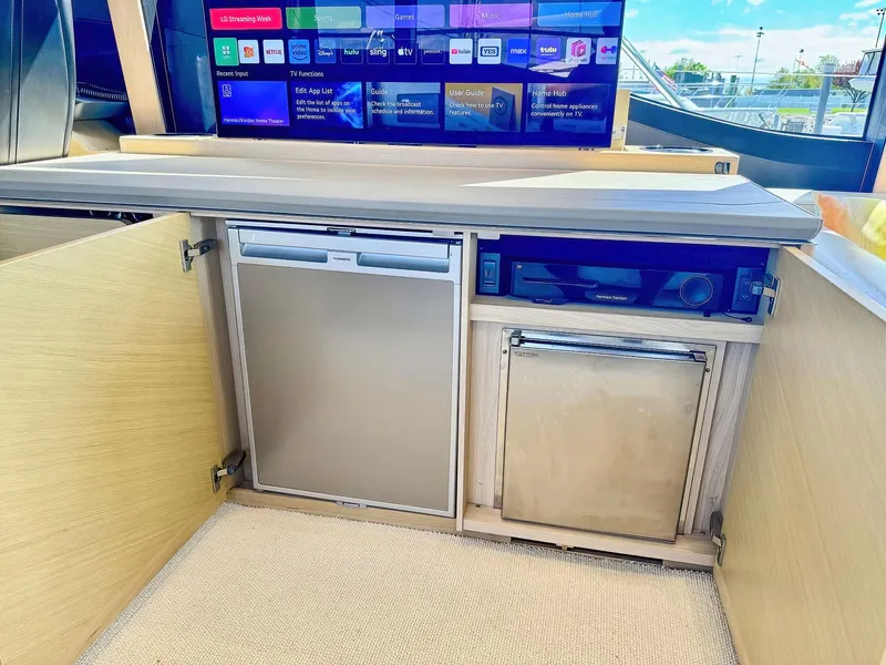 Slide: The Image of 2018 Princess S60 yacht interior with mini fridge and entertainment system. - 37