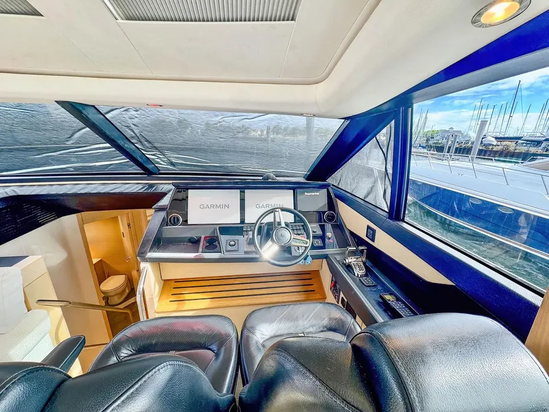 Slide: The Image of Luxurious 2018 Princess S60 yacht helm with leather seating and advanced navigation systems. - 45