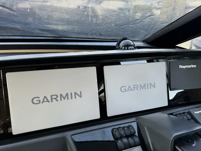 Slide: The Image of Garmin and Raymarine navigation displays on 2018 Princess S60 yacht dashboard. - 46