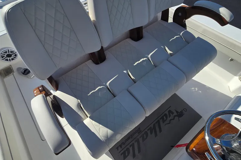 Slide: The Image of Luxury seating on 2025 Valhalla Boatworks V-29 Hybrid, featuring diamond-stitched upholstery and armrests. - 7