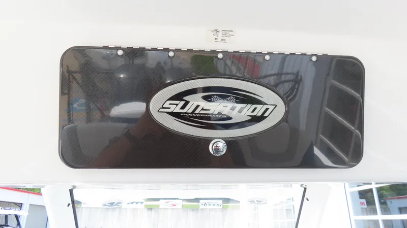 Slide: The Image of 2015 Sunsation 34 CCX boat dashboard with logo and carbon fiber finish. - 13