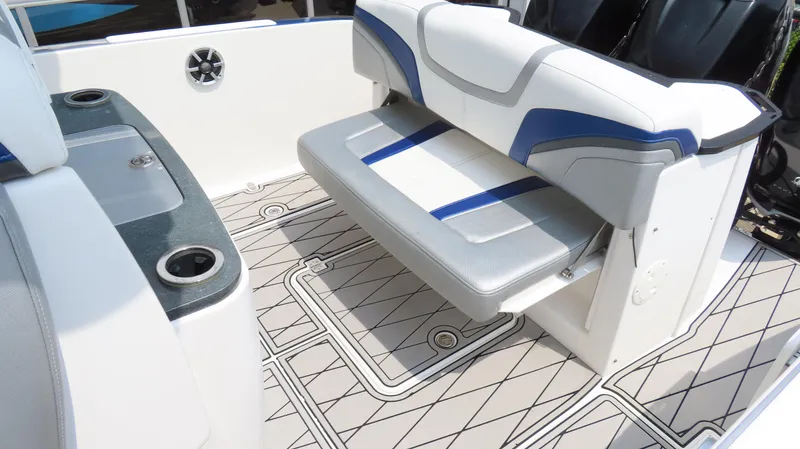 Slide: The Image of 2015 Sunsation 34 CCX boat interior with cushioned seating and patterned flooring. - 17
