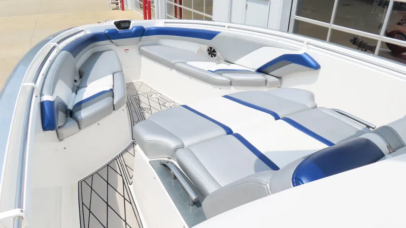 Slide: The Image of 2015 Sunsation 34 CCX boat interior with blue and gray seating, modern design. - 19