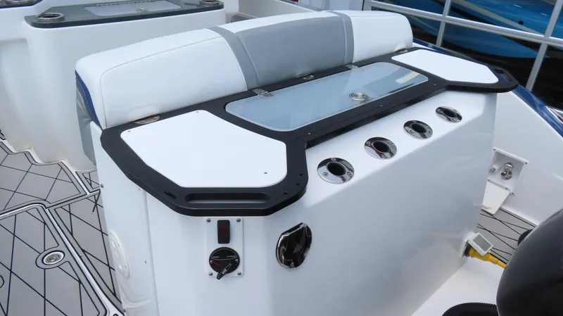 Slide: The Image of 2015 Sunsation 34 CCX boat interior with seating and control panel. - 9
