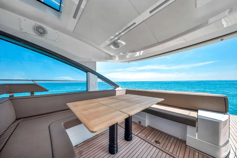 Slide: The Image of Luxurious 2018 Fairline Targa 53 OPEN yacht interior with ocean view and elegant seating area. - 14