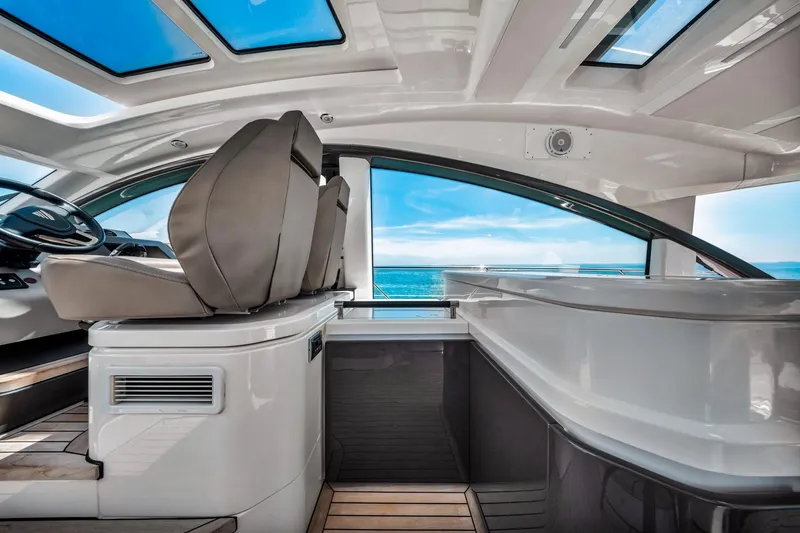 Slide: The Image of Interior of 2018 Fairline Targa 53 OPEN yacht with ocean view through large windows. - 21