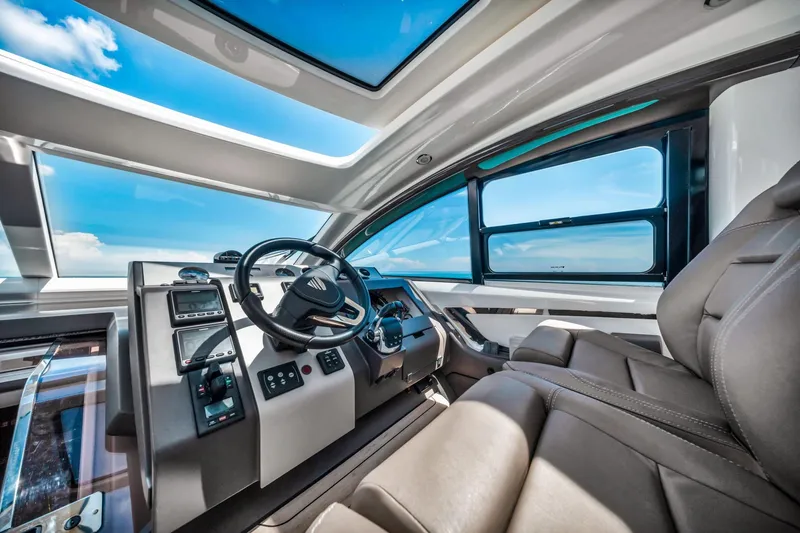 Slide: The Image of Interior of 2018 Fairline Targa 53 OPEN yacht, featuring modern helm and luxurious seating. - 22