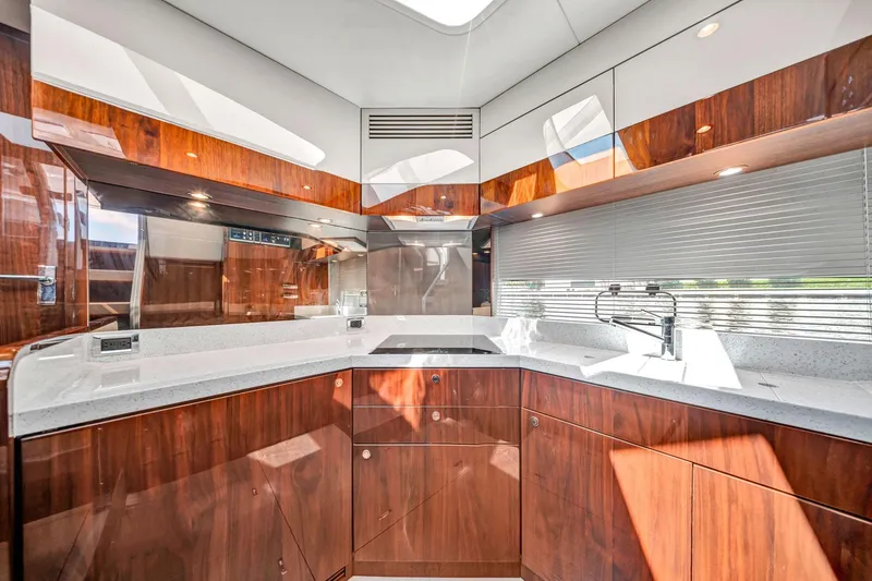 Slide: The Image of Luxurious kitchen interior of 2018 Fairline Targa 53 OPEN yacht with modern wood cabinetry. - 26