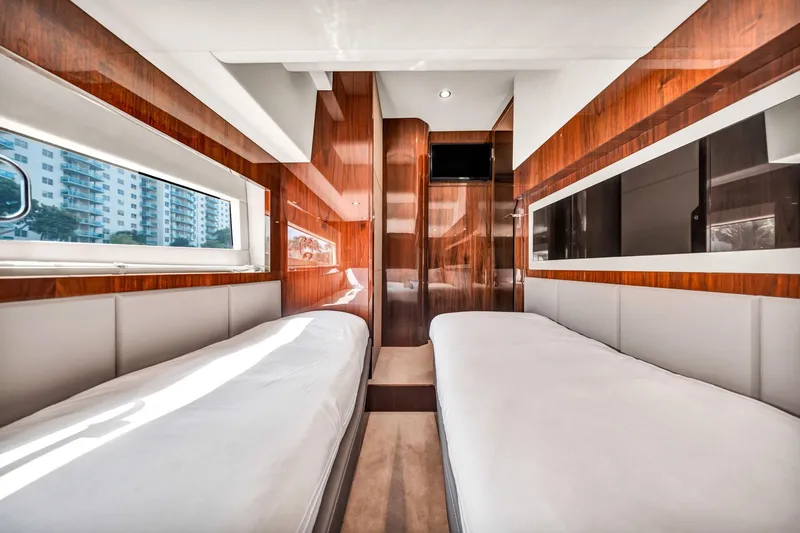 Slide: The Image of Luxurious interior of 2018 Fairline Targa 53 OPEN yacht with twin beds and wood paneling. - 30