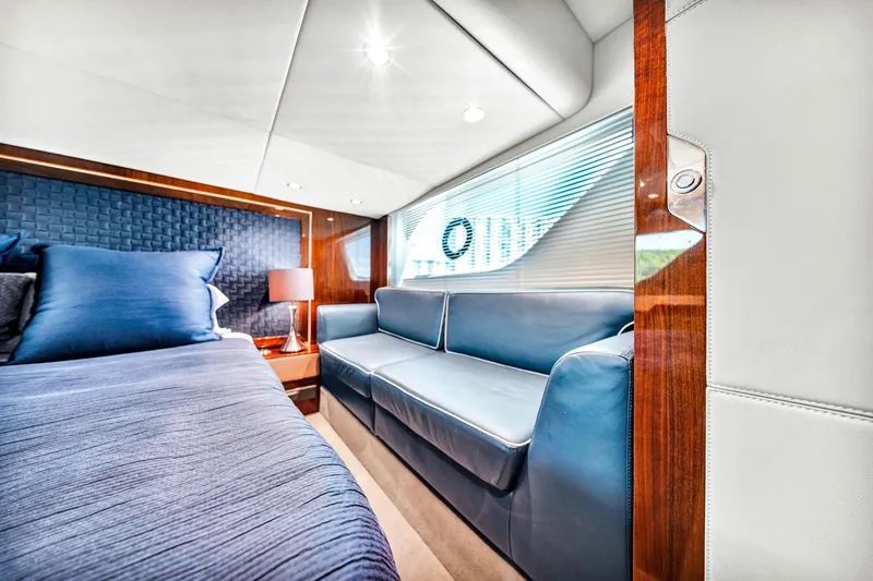 Slide: The Image of Luxurious interior of 2018 Fairline Targa 53 OPEN yacht with blue seating and elegant decor. - 36