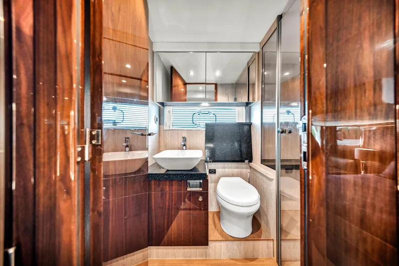 Slide: The Image of Luxurious bathroom interior of 2018 Fairline Targa 53 OPEN yacht, featuring modern fixtures and wood finishes. - 39