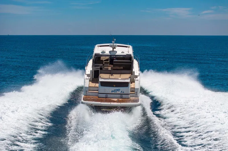 Slide: The Image of 2018 Fairline Targa 53 OPEN yacht cruising on open sea, rear view. - 48