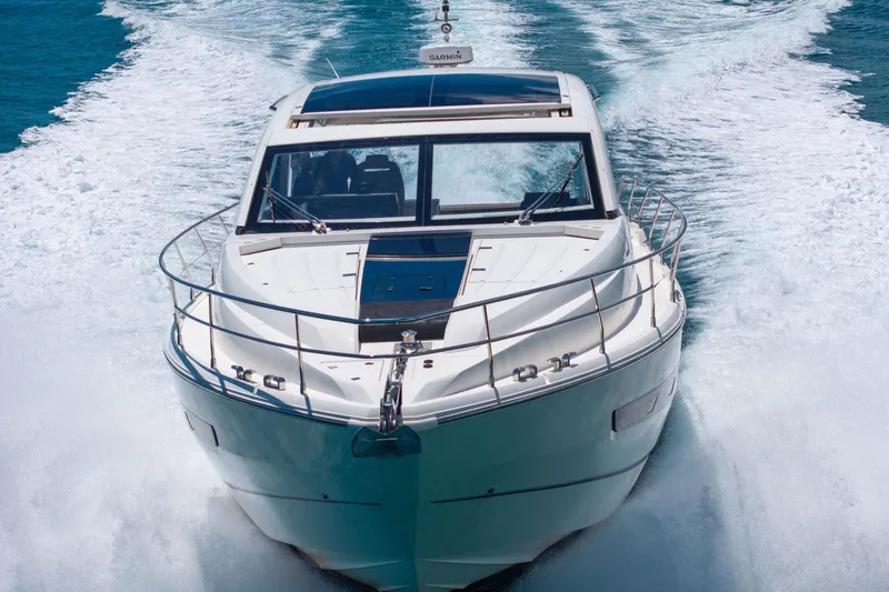 Slide: The Image of 2018 Fairline Targa 53 OPEN yacht cruising on open water, front view. - 50