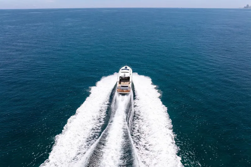 Slide: The Image of 2018 Fairline Targa 53 OPEN yacht cruising on open sea, leaving a wake. - 53