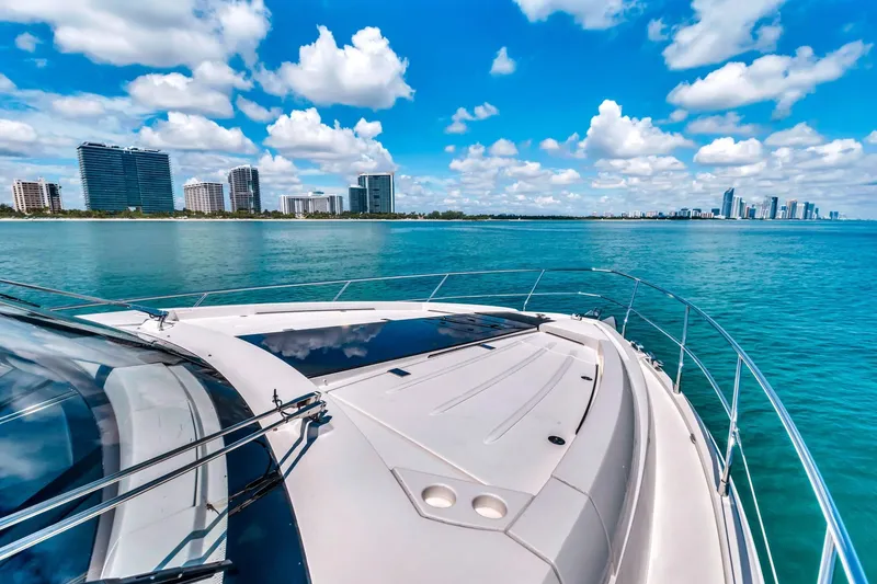 Slide: The Image of 2018 Fairline Targa 53 OPEN yacht cruising near city skyline under blue sky. - 9
