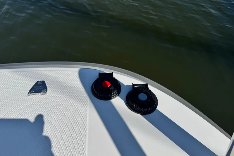 Slide: The Image of Close-up of 2025 Nimbus Commuter 9 boat deck with water in the background. - 10