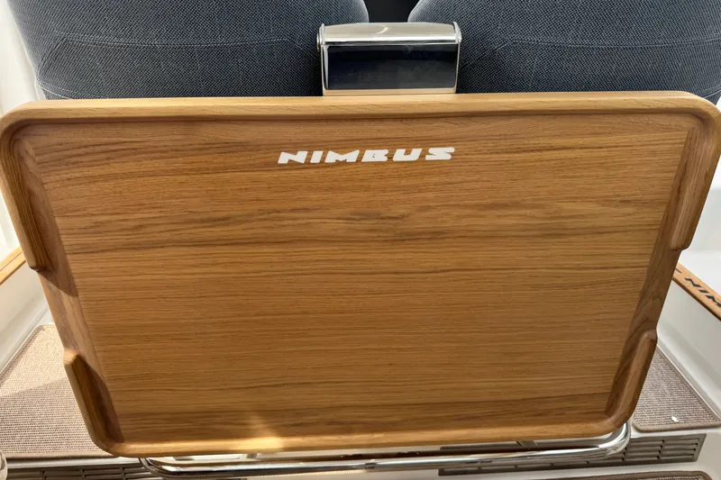 Slide: The Image of Wooden seat back with "Nimbus" logo in a 2025 Nimbus Commuter 9 vehicle. - 20