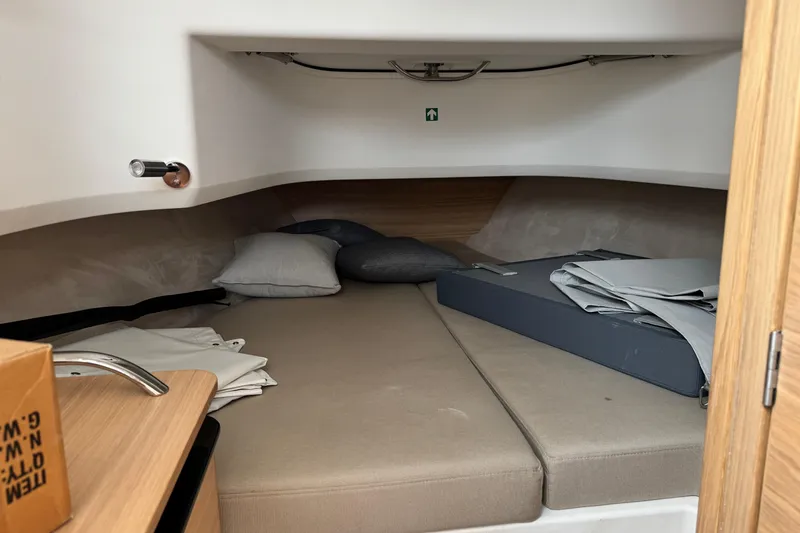 Slide: The Image of Cozy cabin interior of 2025 Nimbus Commuter 9 with cushions and storage space. - 21