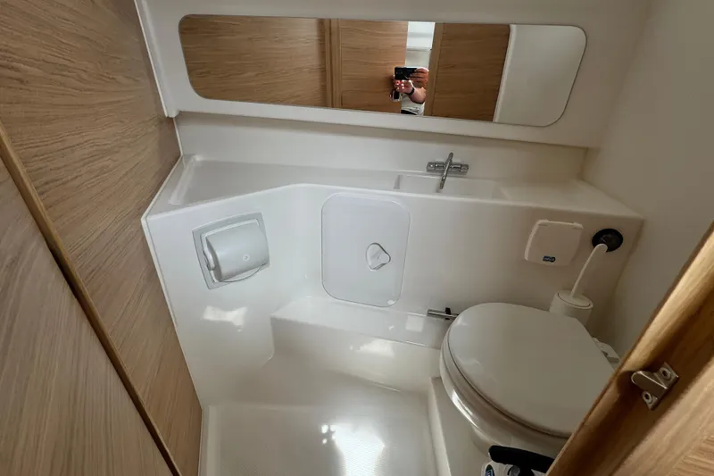 Slide: The Image of Compact bathroom in 2025 Nimbus Commuter 9, featuring modern fixtures and wood accents. - 22