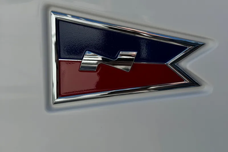 Slide: The Image of Emblem of 2025 Nimbus Commuter 9 with red and blue design. - 24