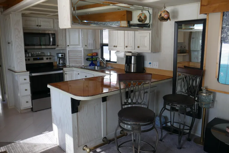 Slide: The Image of Electric fireplace in a 1996 STARDUST Cruiser, featuring realistic logs and cozy ambiance. - 13