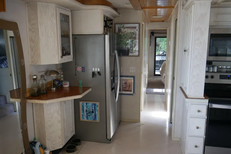 Slide: The Image of Kitchen sink in 1996 STARDUST Cruiser RV with fruit bowl and window view. - 20