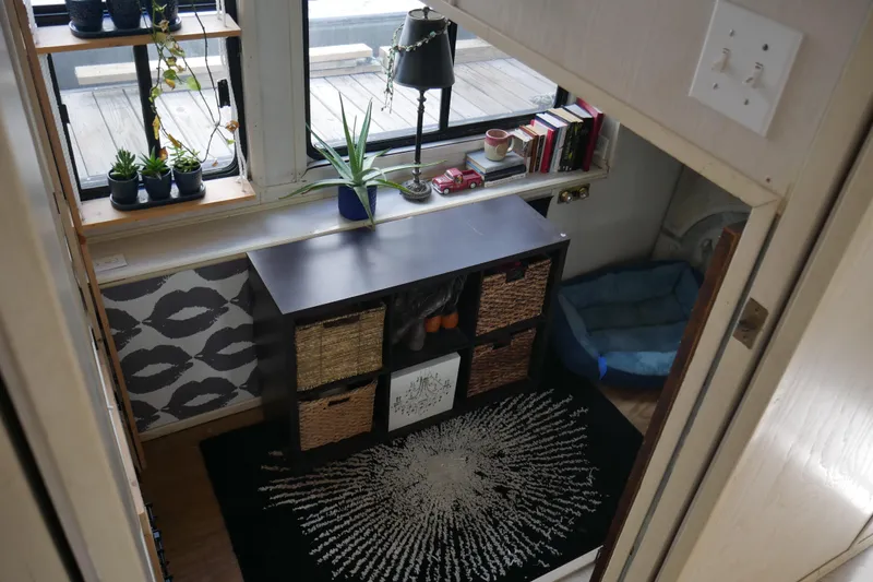 Slide: The Image of Compact bathroom in 1996 STARDUST Cruiser with heron artwork and modern decor. - 24