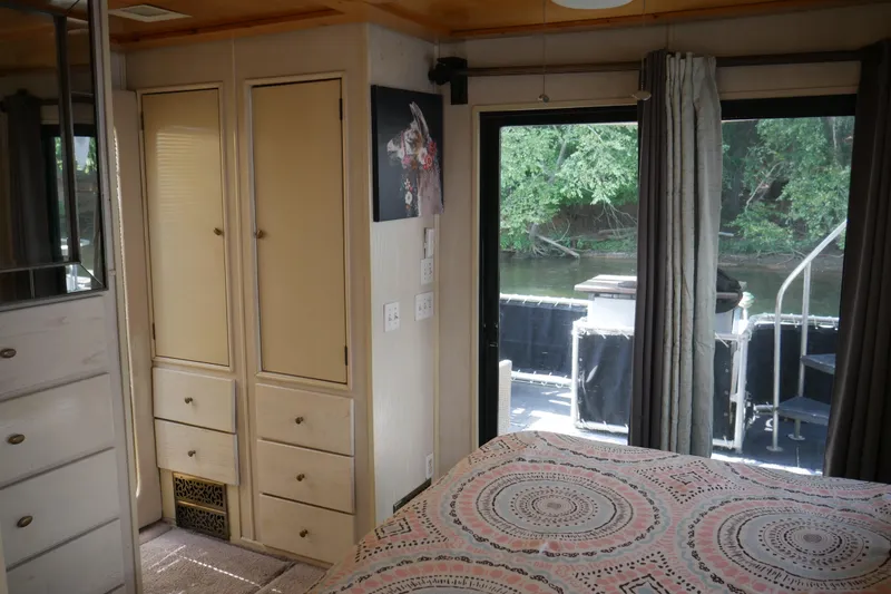 Slide: The Image of Cozy interior of 1996 STARDUST Cruiser with plants, books, and decorative storage. - 27