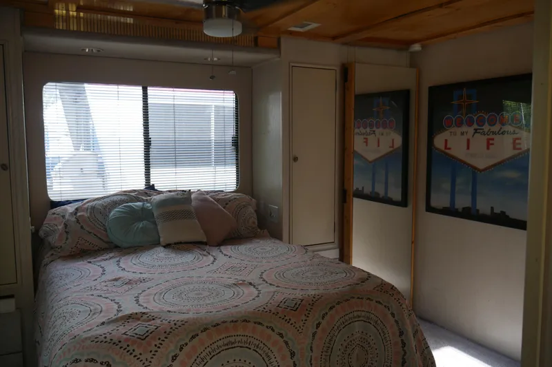 Slide: The Image of Interior of 1996 Stardust Cruiser with plants, decorative rug, and natural light. - 28